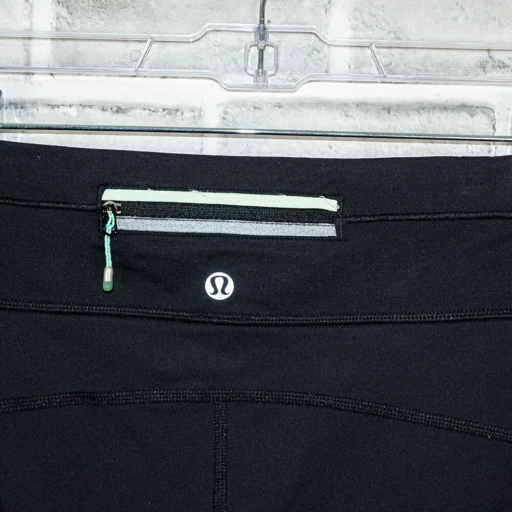Lululemon two tone Green Black Leggings mesh side size 4